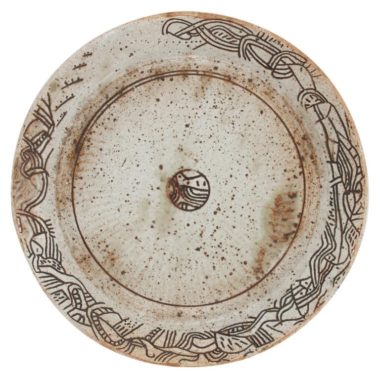 Korean Buncheong-Style Stoneware Dish: Item/Description: Buncheong-style circular stoneware dish featuring the distinctive stamped and slip-filled decoration. Interior embellished with an intricate border of stylized interlocking scrolls
