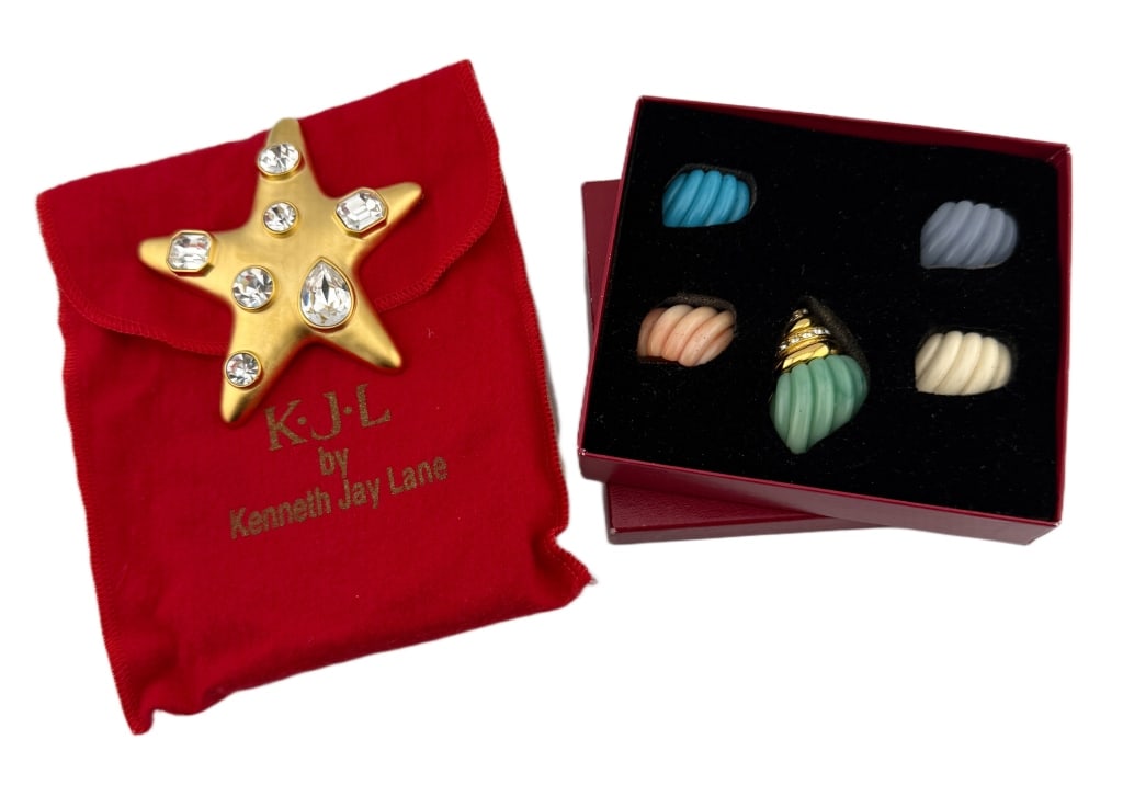 Kenneth Jay Lane Sea Creature Brooch Lot: Item/Description: Signed KJL figural brooches by iconic costume jewelry designer, Kenneth Jay Lane. The lot includes a large figural starfish brooch and a conch seashell brooch with five interchangeab