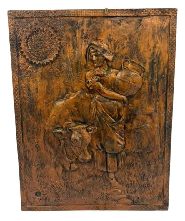 Pastoral Copper High Relief Plaque: Item/Description: Copper relief wall art plaque featuring a young milkmaid holding a jug, standing beside a cow. Sun or sunflower in upper left corner. Bas-relief pastoral scene. *This item is being r