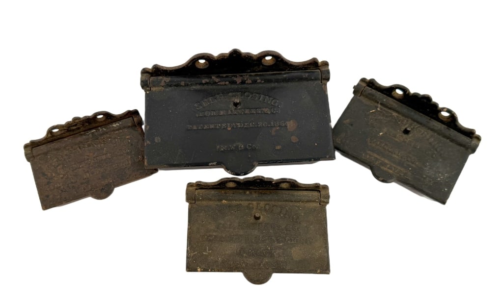 Antique Cast Iron Wall Match Safes: Item/Description: Collection of five Civil War-era cast iron match safes designed to hang on a wall. Featuring "self-closing" hinged lids and a built-in strike plates. Embossed with a patent dates, ma