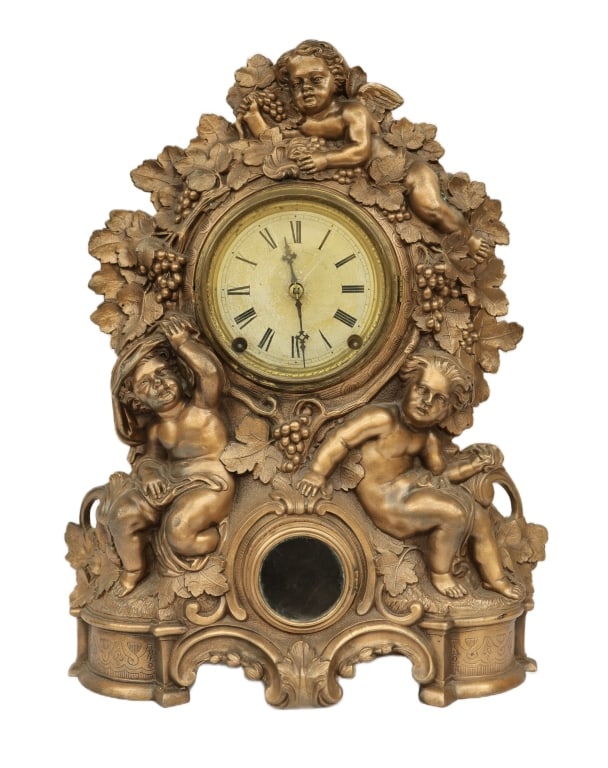 1856 Nicholas Muller Bacchanalian Putti Clock: Item/Description: Antique American mantel clock featuring an intricately cast iron architectural case designed and patented by pioneering metalworker Nicholas Muller in New York City. Ornate shell dep