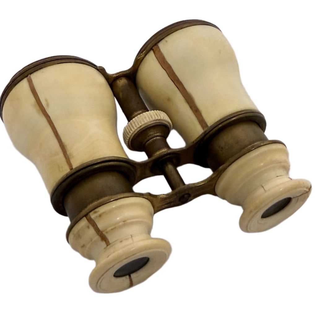 Antique Late Victorian Opera Binoculars: Item/Description: Pair of French theatre or opera binoculars crafted with a solid brass expandable bridge and central mechanical focus wheel. The barrels and flared eye cups are finished in a