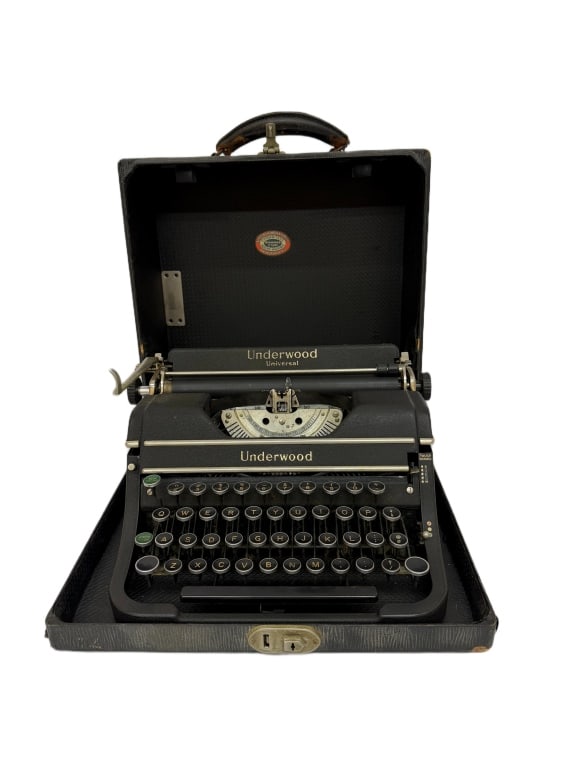 1930s Underwood Universal Portable Typewriter: Item/Description: 1930s Underwood Universal manual portable typewriter featuring a textured wrinkle-finish black enamel body, accented by chrome components and four banks of distinct circular glass-to