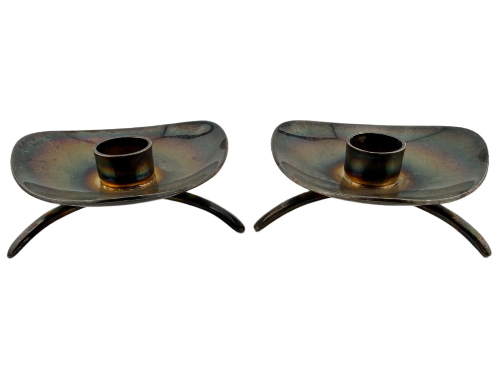 Danish Cohr Mid-Century Modern Candle Sticks: Item/Description: Pair of small Danish mid-century modern candle holders by Carl M. Cohr of Fredericia, Denmark, under the "ATLA" silver-plate line. Featuring an asymmetrical, low-profile curved dish 