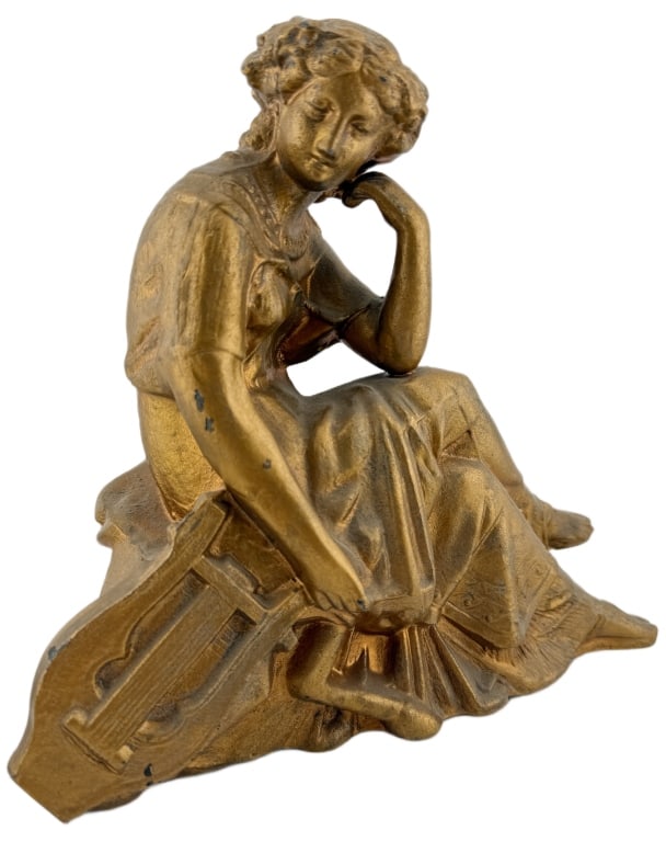 19th Century "Lady with Lyre" Ansonia Clock Topper: Item/Description: Neoclassical style cast metal sculptural figure, originally manufactured as a mantel clock topper for the Ansonia Clock Company. Sculpture features a seated female figure resting her