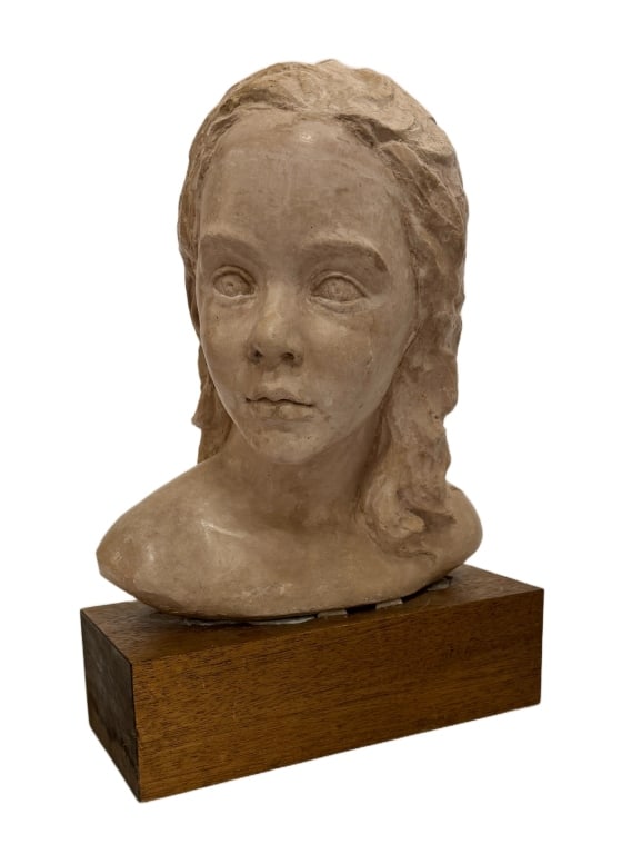 Jeanne Gevaert Signed Bust of Woman Sculpture: Item/Description: Sculpture features the head of a female with shoulder length hair. Signed to back. Mounted on wood base. Removable from the base. Jeanne Gevaert (1923?2017) was a Belgian-American sc