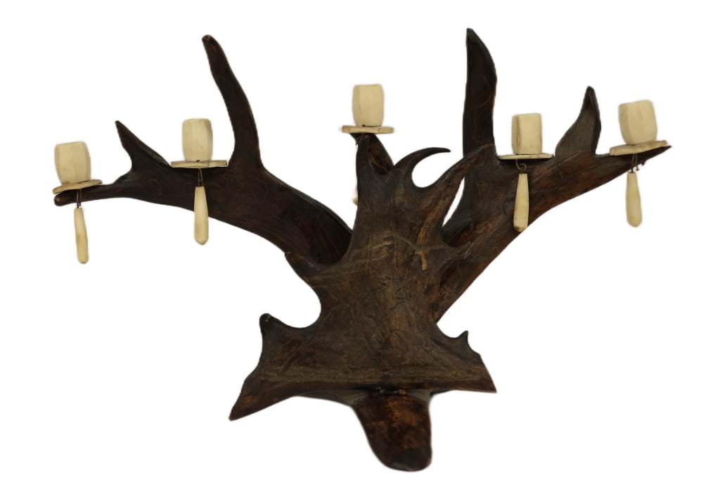 Rustic Black Forest Antler Wall Candelabra: Item/Description: Rustic lodge-style wall-mounted candelabra crafted in a classic European Black Forest style. The piece uses naturally shed stag or fallow deer antlers to form a striking five-light f