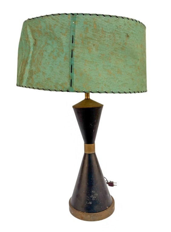 MCM Atomic Hourglass Table Lamp & Fiberglass Shade: Item/Description: A Mid-Century Modern "Atomic" style table lamp, circa 1950s. Features a classic double-cone hourglass body in black-finished metal accented by polished brass collars and a round wood