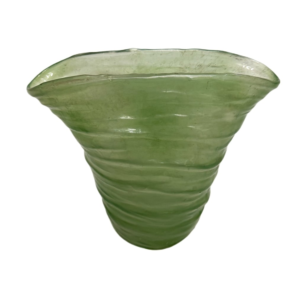 Consolidated Glass Catalonian Green Fan Vase: Item/Description: Translucent green art glass vase with an organic wavy silhouette and asymmetrical rim from Catalonia, Spain. Features a textured surface with subtle swirl patterning and visible air 