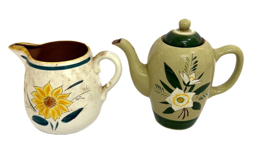 MCM American Stangl Star & Garden Flower Pottery: Item/Description: Two pieces of mid-century American Stangl Pottery featuring the "Star Flower" covered teapot and a "Garden Flower" sunflower-motif cream pitcher. Pottery showcases the American manuf
