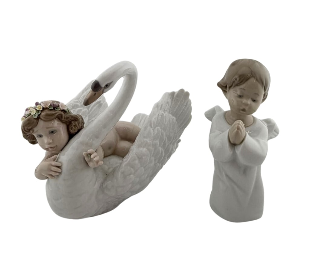 Lladro Angel & Swan Porcelain Figurines: Item/Description: Two porcelain figurines handcrafted by Lladro in Valencia, Spain. Includes "Angel Praying" (Model No. 4538), featuring a kneeling cherub with delicate outspread wings. Designed by