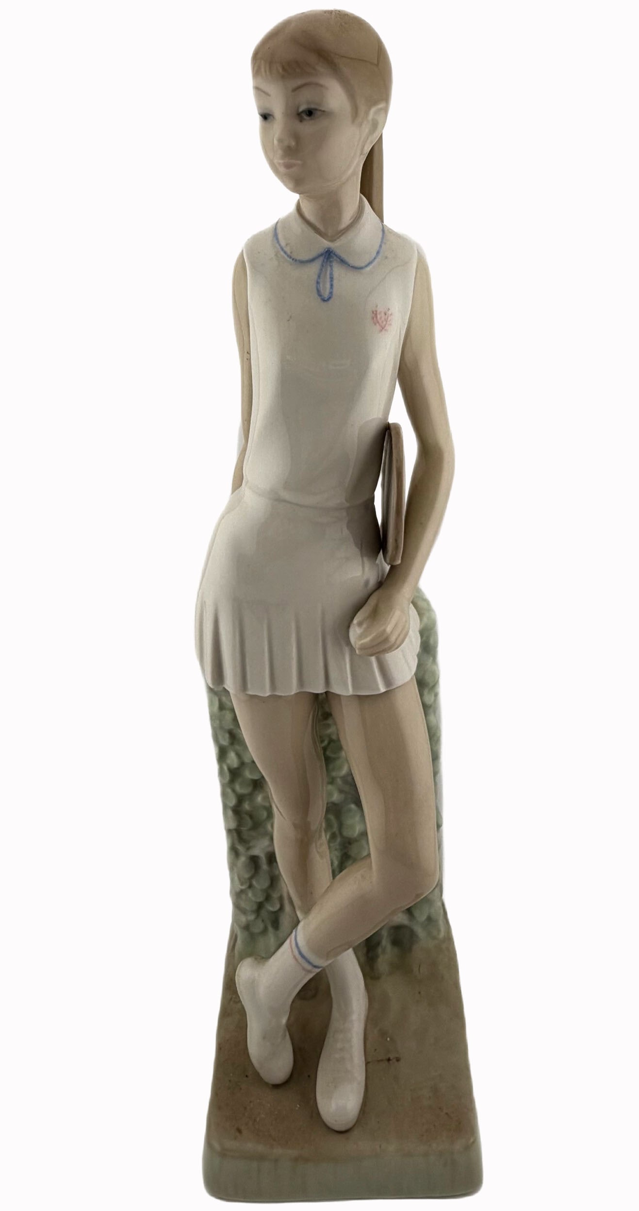 Lladro Tennis Player Girl Porcelain Figurine: Item/Description: Lladro fine porcelain figurine titled "Tennis Player Girl", (Model No. 4798). Sculpted by master artist Vicente Martinez. Issued in 1972, retired in 1981. The sculpture features an