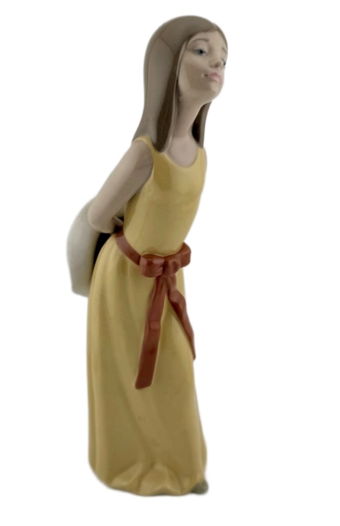 Lladro Naughty Girl with Straw Hat Figurine: Item/Description: Vintage Lladro fine porcelain figurine titled "Naughty Girl with Straw Hat" (Model No. 5006). Hand-sculpted by renowned foundational master artist Francisco Catala, this piece was
