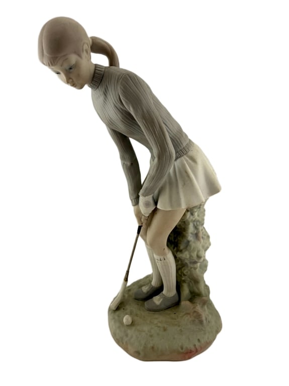 Lladro Lady Golfer Matte Porcelain Figurine: Item/Description: Vintage Spanish matte finish porcelain figurine, titled Lady Golfer (Model No. 4851), sculpted by renowned artist Vicente Martinez for Lladro in Valencia, Spain. Sculpture captures a