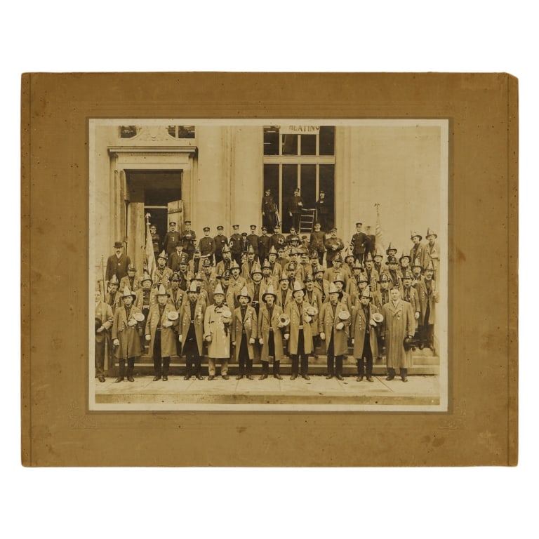 Antique American Fire Department Photograph: Item/Description: Late 19th century group portrait of an American Fire Department. Antique photograph captures a large Victorian fire company in full parade uniform assembled on the steps of a municip