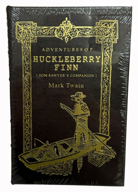 Mark Twain "Adventures of Huckleberry Finn": Item/Description: Collector's volume represents The Easton Press edition of Mark Twain?s masterwork, The Adventures of Huckleberry Finn (Tom Sawyer's Companion). The ornate cover features a gilt-stamp