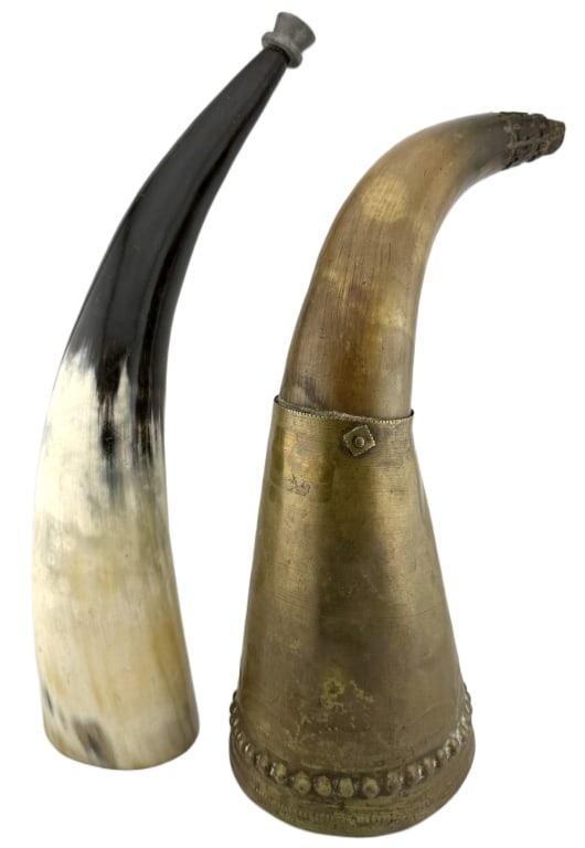 Antique Bovine Blowing & Powder Horns: Item/Description: Two antique vessels crafted from natural bovine horn, widely used during the 19th century. Features a polished, high-contrast blowing horn featuring a scraped natural surface and a f