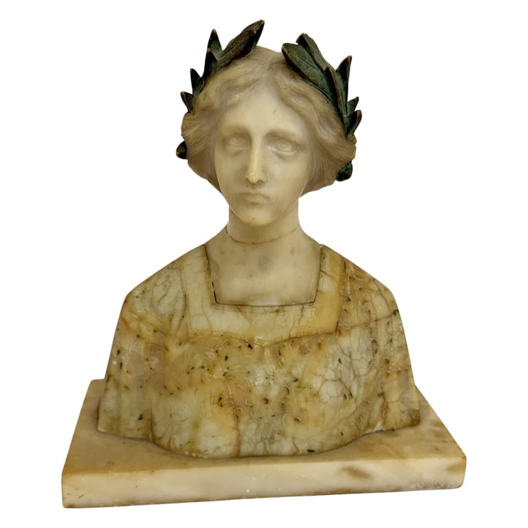 Italian Art Nouveau Carved Maiden Bust: Item/Description: Antique Italian salon-style bust sculpture hand-carved from Italian marble and alabaster, depicting a young woman wearing a laurel crown nestled in her hair. Crafted during the Belle
