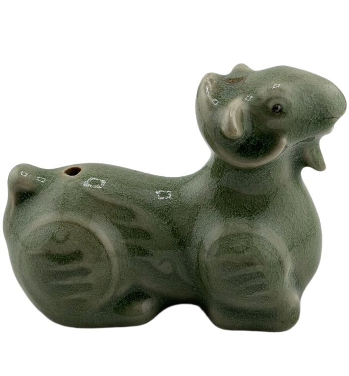 Celadon Crackle-Glazed Ram Water Dropper: Item/Description: Artist signed celadon, crackle-glazed ceramic water dropper, modeled in an Asian archaic style. Ram is depicted kneeling with its limbs tucked close to the body, with incised stylize