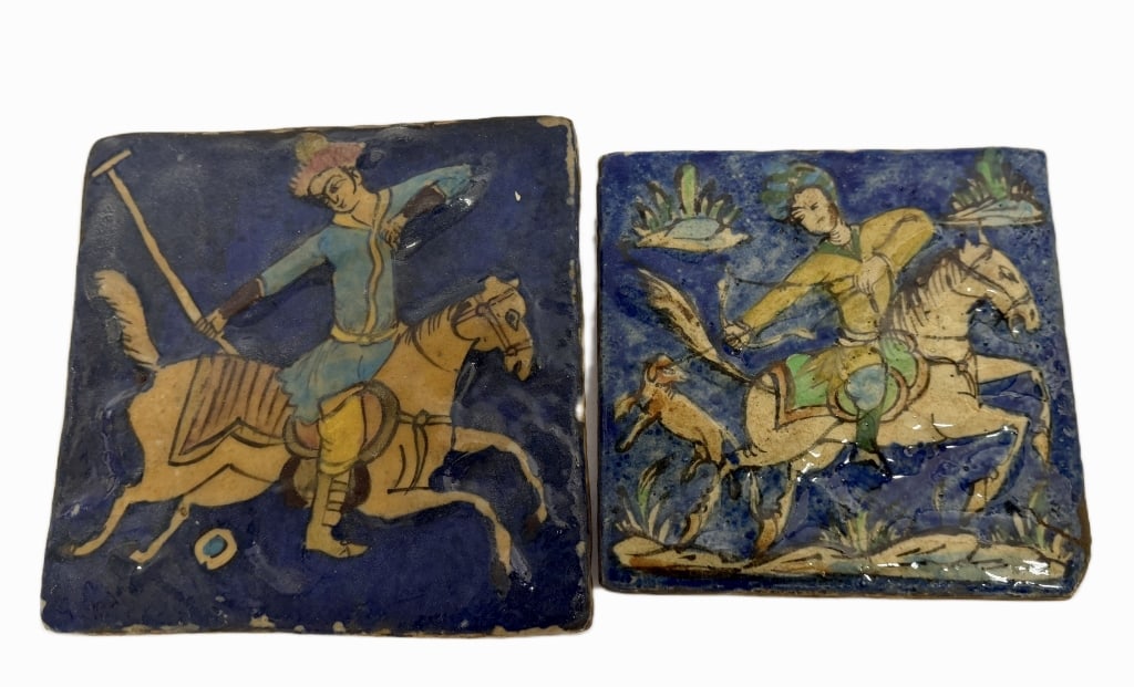 Persian Qajar Equestrian Cobalt Fritware Tiles: Item/Description: Pair of Persian pottery tiles illustrating classic courtly and athletic pursuits favored by the royalty of the Qajar Empire. One tile features a princely figure engaged in a a game o