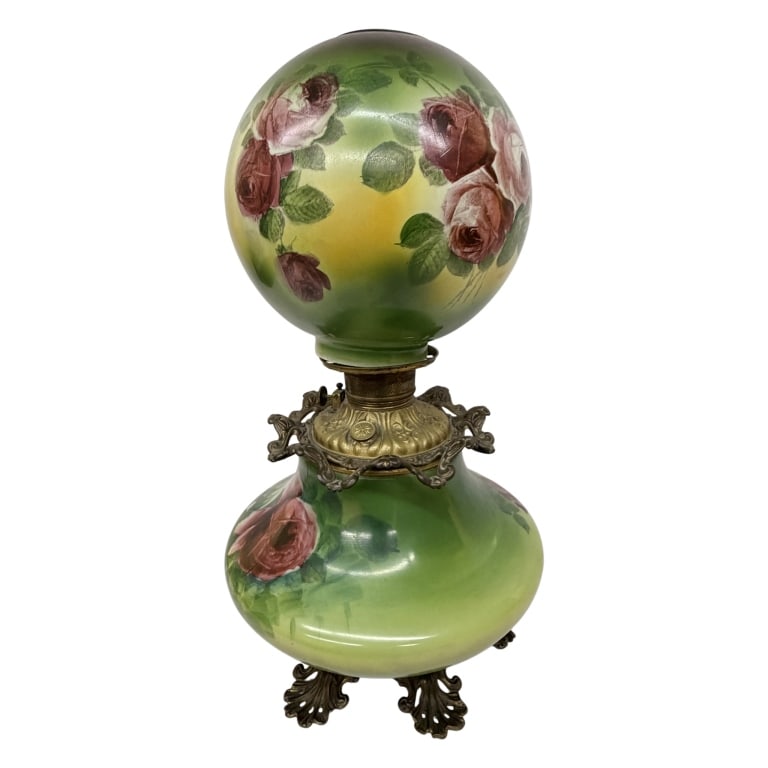 Victorian Green Double-Globe Parlor Lamp: Item/Description: Antique Victorian era parlor table lamp, "Gone with the Wind" or hurricane lamp, crafted with matching upper and lower opaque milk glass globes, produced circa 1900. Features pink an