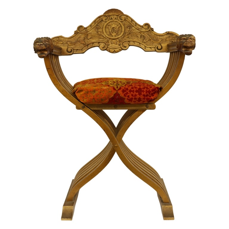 Renaissance Revival Savonarola Chair: Item/Description: Florentine Renaissance Savonarola Chair, also known as an X-chair or Dante chair. Carved, gilt wood chair features "curule" frame, composed of multiple interlaced curved slats, carve