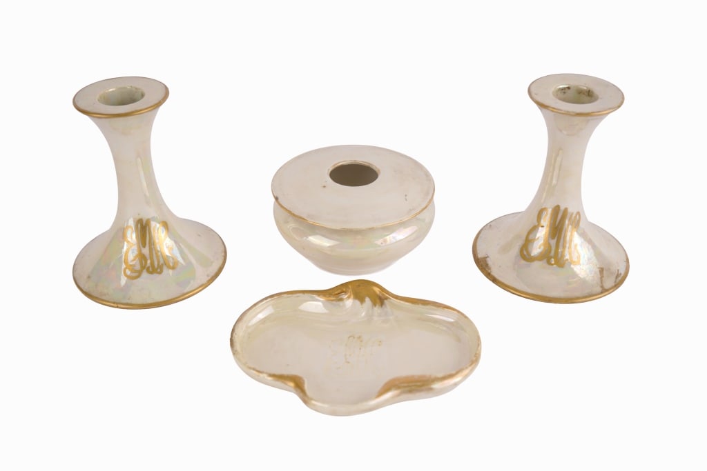 Opalescent Porcelain Dressing Table Set: Item/Description: Early 20th century iridescent porcelain dressing table set comprising a pair of trumpet-form candlesticks, a circular lidded hair receiver, used to collect hair from brushes to later