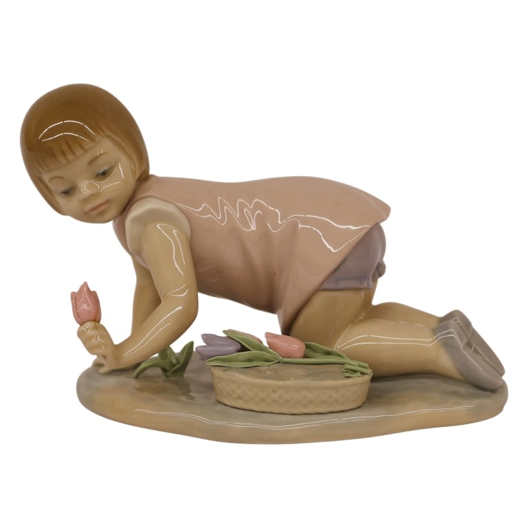 Lladro "Girl Kneeling with Tulips" Figurine: Item/Description: Lladro fine porcelain figurine titled "Girl Kneeling with Tulips" (#5041), sculpted by artist Francisco Catala. Sculpture captures a young girl with a blonde bob in a mauve-pink dres