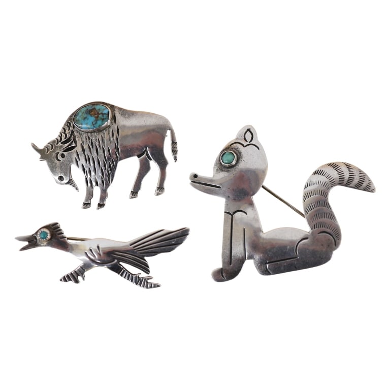 Native American Sterling Figural Brooch Lot: Item/Description: Trio of Native American Navajo figural animal pins. Whimsical brooches crafted from Sterling Silver and accented by genuine turquoise stones. Includes a seated fox, roadrunner bird,