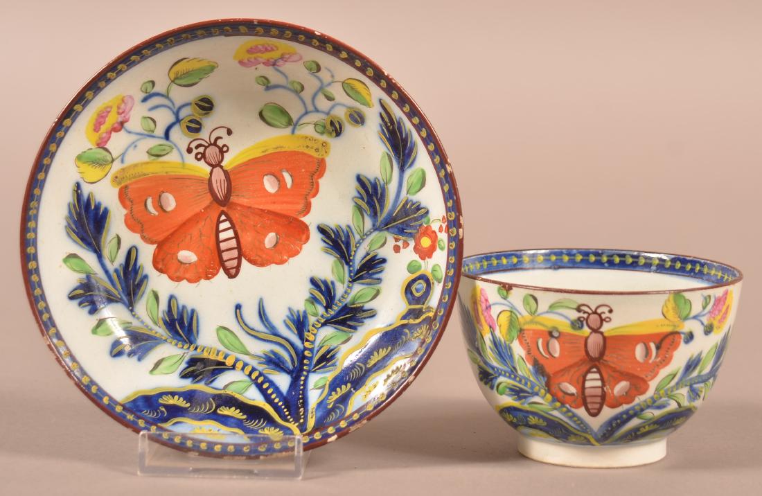 Gaudy Dutch Butterfly Patt. China Cup & Saucer.: Gaudy Dutch Butterfly Pattern Soft Paste China Cup and Saucer. Saucer measures 5-3/8" diam. Condition: Very good with minor wear and pin nip on base rim of saucer.