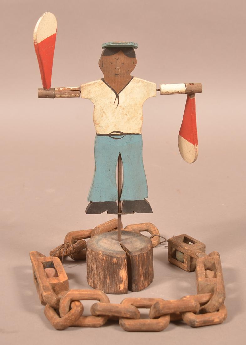 Folk Art Carved Chain Whimsy and Sailor Whirly-Gig.: Folk Art Carved Chain Whimsy and Sailor Whirly-Gig. Chain measures 29-1/2"l., whirly-gig Measures 13-3/4"h. Condition: Good with wear.