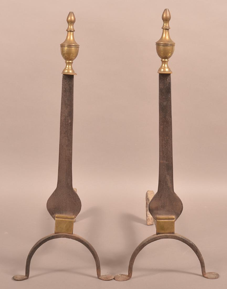 Pair of 19th Century Brass and Iron And Irons.: Pair of 19th Century Brass and Iron And Irons. Brass urn finials, flattened wrought iron vasiform shafts with arched legs and penny feet. 23-1/4"h. Condition: Good with rust and pitting.