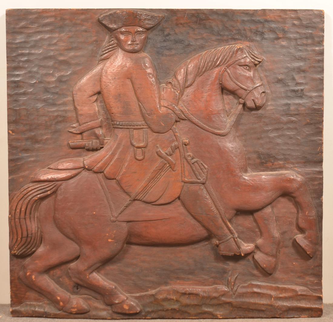 Folk Art Man on Horseback Wood Plaque.: Raise Carved Folk Art Man on Horseback Wood Plaque. Labeled on back "Karl Mann, New York". 36" square. Condition: Good with minor insect damage.