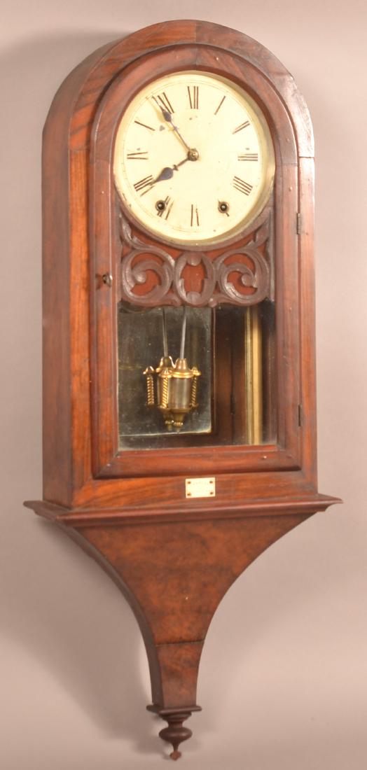 English Rosewood and Burl Wood Wall Clock.: Antique English Rosewood and Burl Wood Wall Clock. 8 day spring driven time and strike movement, with a painted dial, plaque reading "Thomas Llandovery." 36-1/2"h. x 14"w. x 6"d. Condition: Good with
