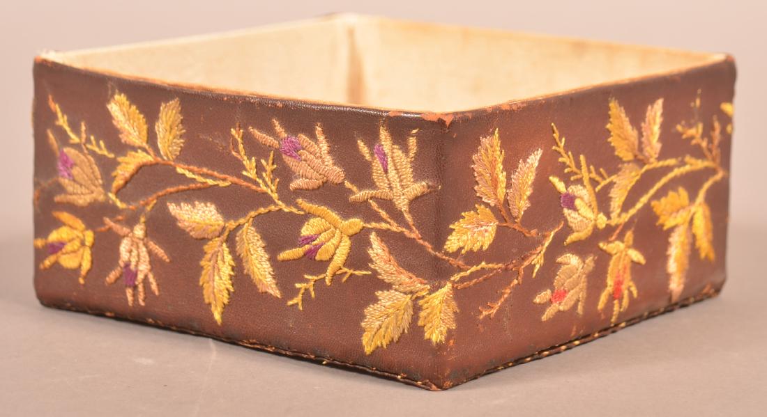 Sewing/Ribbon Box with Floral Needlework.: 19th Century Leatherette Sewing/Ribbon Box with Floral Needlework. 3"h. x 6-1/4"square. Condition: Good with wear.