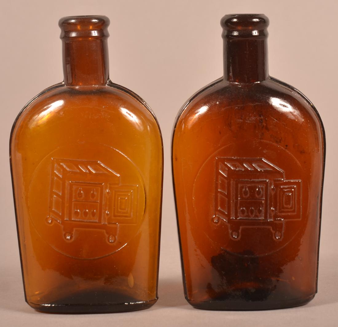 Two Amber Glass Whiskey Flasks. (1 of 3)