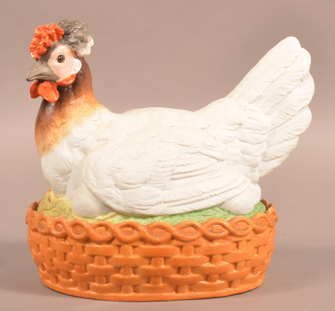 Antique Bisque Hen on Nest.: Antique Bisque Hen on Nest. With original porcelain egg holder. 10"h. Condition: Good with minor chips.