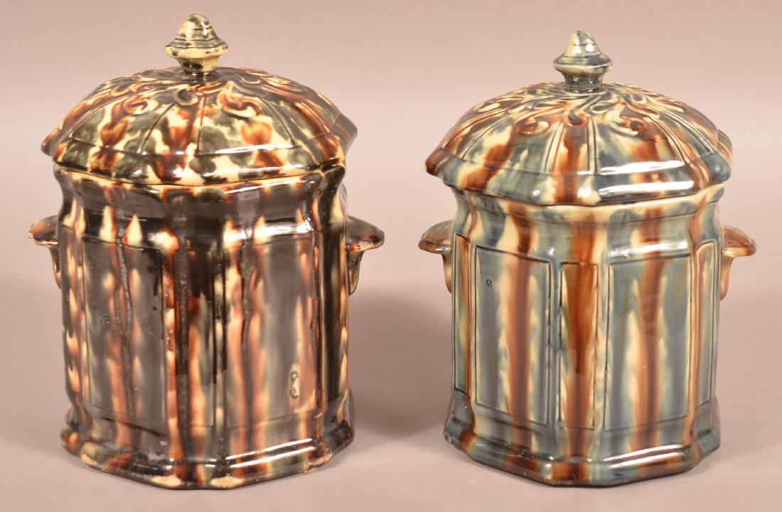 Two Similar Glazed Pottery Covered Canisters.: Two Similar Glazed Pottery Covered Canisters. 10-1/4"h. Condition: Good with minor chips.