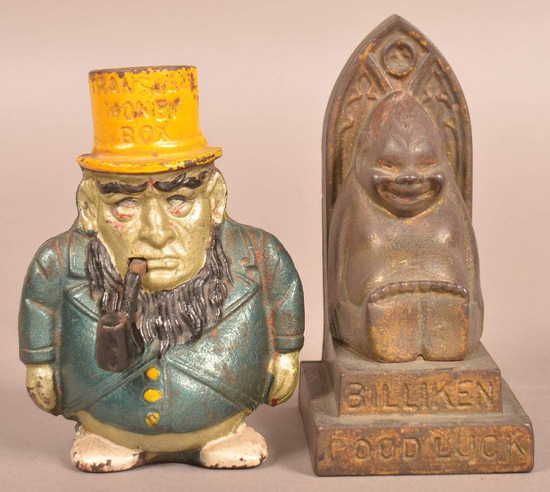 Two Cast Iron Figural Still Banks. (1 of 4)