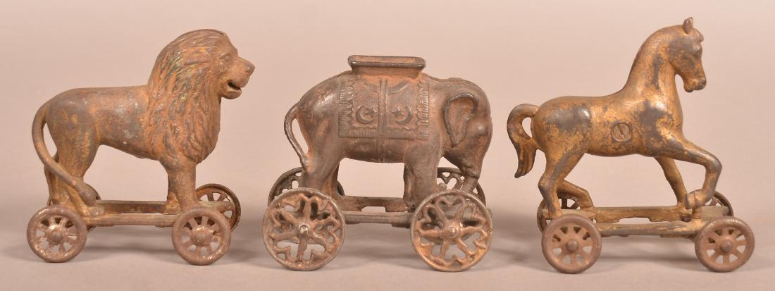 Three Animal on Wheels Cast Iron Still Banks. (1 of 3)