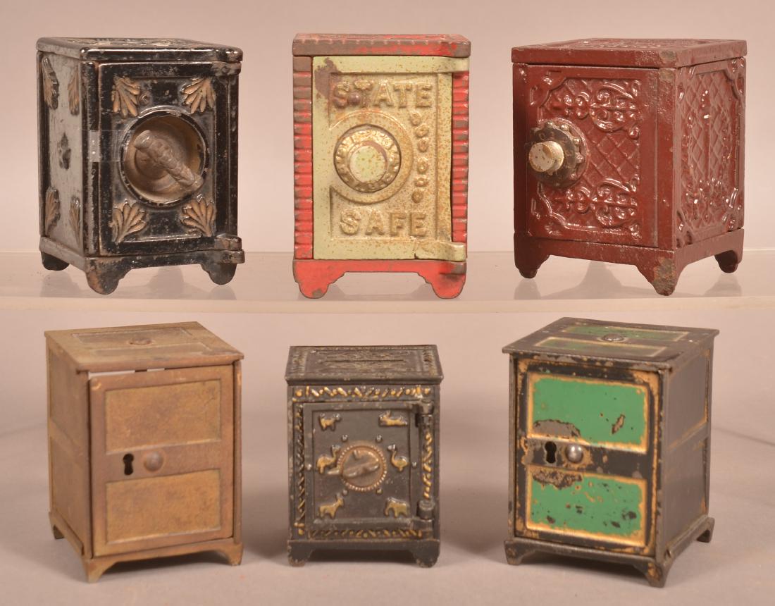Six Painted Cast Iron Safe Still banks. (1 of 3)