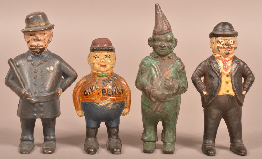 Four Cast Iron Figural Still Banks. (1 of 3)