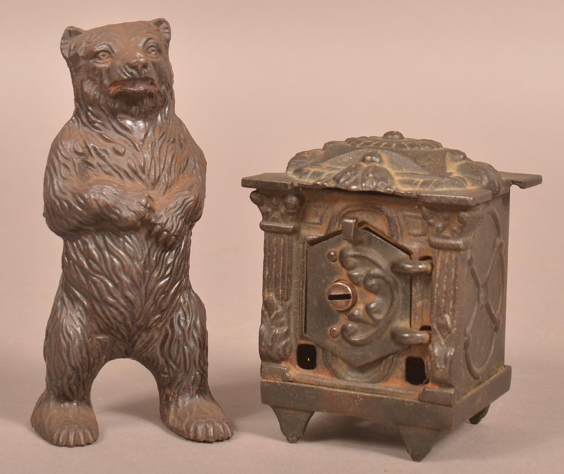 Two Antique Cast Iron Still Banks. (1 of 3)