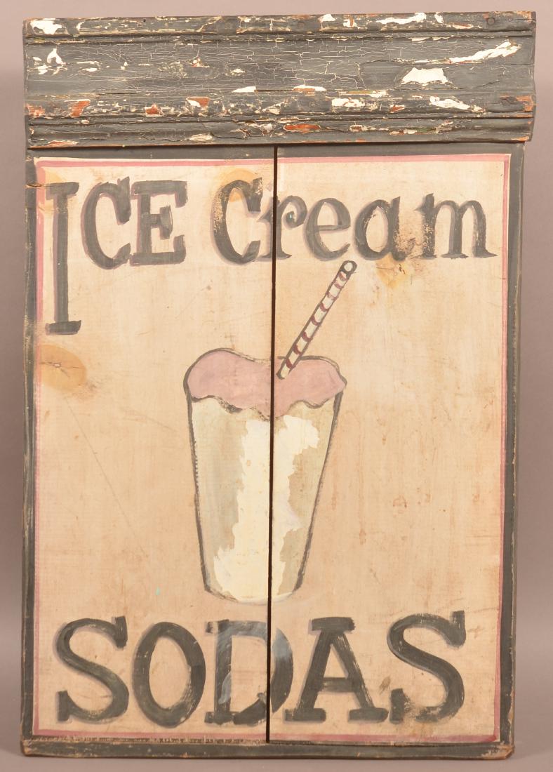 Vintage Painted Wood "Ice Cream Sodas" Sign.: Vintage Painted Wood "Ice Cream Sodas" Sign. Single sided with baseboard cornice. 27-1/2" x 18-1/2". Condition: Good with wear and losses.