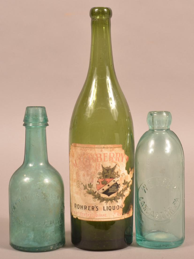 Three Various Antique Pennsylvania Bottles.: Three Various Antique Pennsylvania Bottles. W.B. Frey, Lancaster, Pa. clear blob top hutch bottle, smooth bottom, 6-3/4"h. Rohrer's Liquor Store Blackberry Wine Lancaster, Pa. paper label olive green 