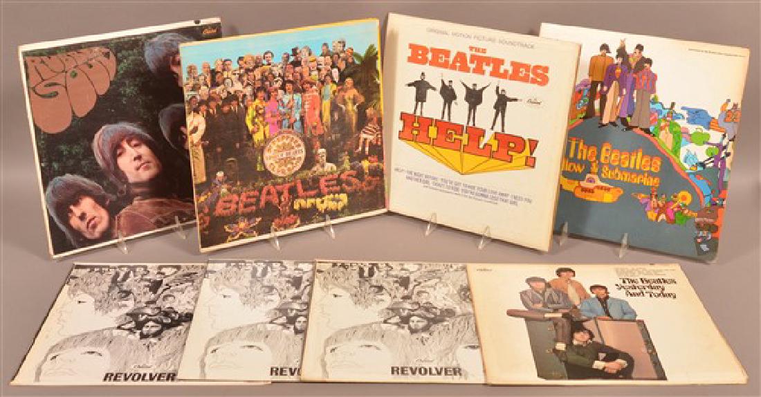 8 Beatles LPs Including Sgt Peppers & Help: Lot of 8 vintage Beatles LPs including: Sgt. Peppers (Capitol MAS-2653) with cut-outs / Help (Capitol MAS-2386) / Yellow Submarine (Capitol SW153) / Rubber Soul (Capitol T2442) / Yesterday & Today (Ca