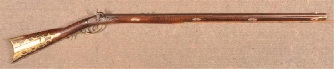 Antique Pennsylvania Kentucky Percussion Rifle.: Antique Pennsylvania Kentucky Full Stock Percussion Rifle. 36" octagonal barrel signed "J. Fleeger", four piece Brass patch box and furniture. German silver inlays. 51"l. overall. Condition: Good, con