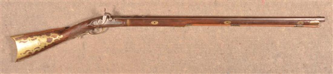 Antique Pennsylvania Kentucky Percussion Rifle.: Antique Pennsylvania Kentucky Full Stock Percussion Rifle. 34-1/2" octagonal barrel, Brass patch box and furniture. 50"l. overall. Condition: Good, converted to percussion from original flint, other r