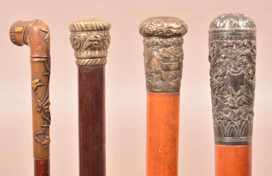 Four Antique/Vintage Metal Handled Canes. (1 of 9)