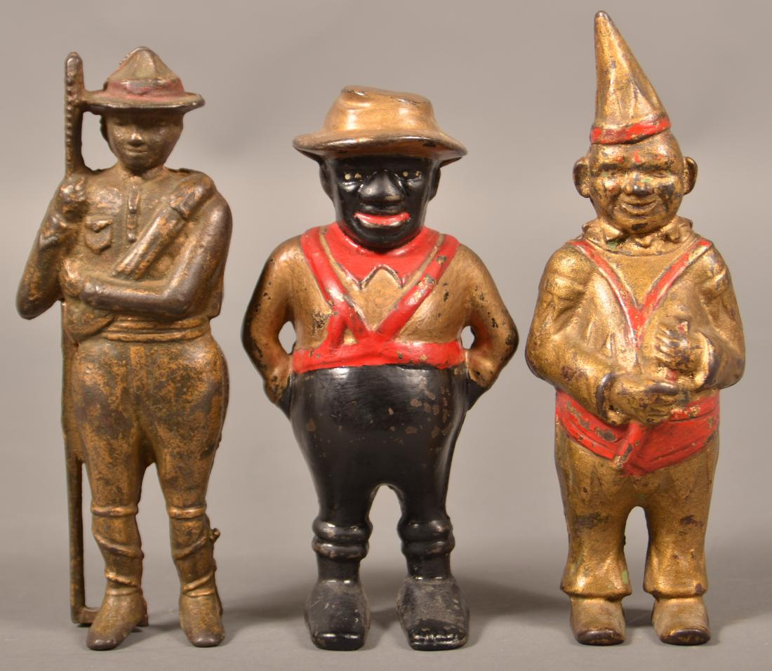 Three Figural Cast Iron Still Banks. (1 of 3)